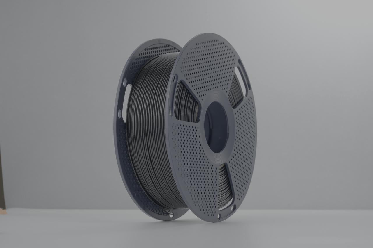 FibreSeek PETG Basic black filament spool, angled view